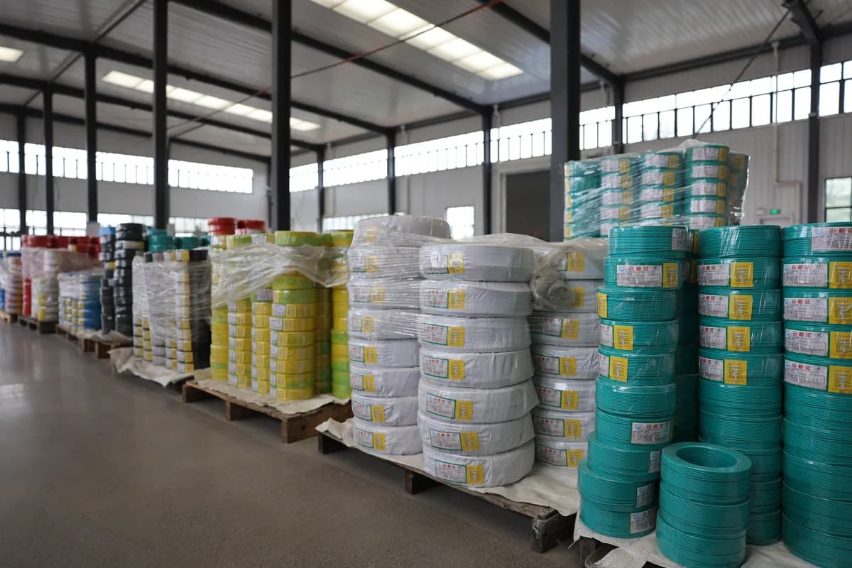 Finished goods area with drums of armoured power cable in a Chinese cable factory warehouse