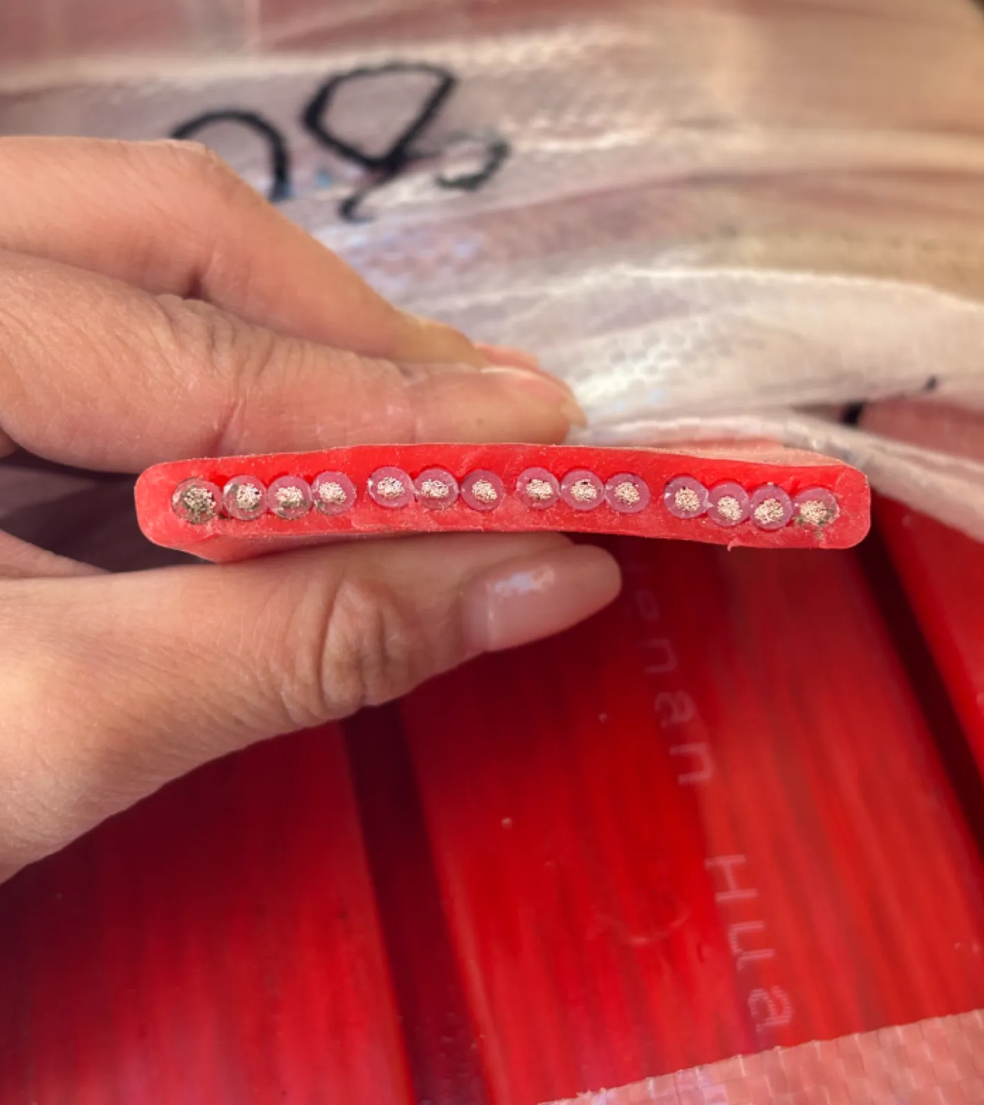 Cross-section of a fire-resistant multicore cable showing mica mineral barrier over each conductor under a red fire-rated sheath